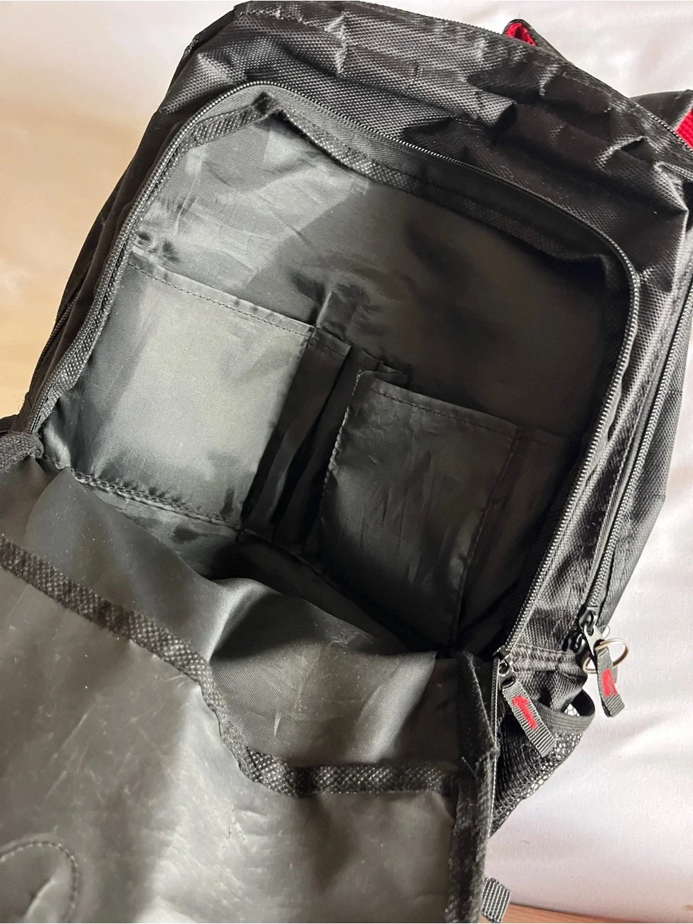 Black & Red Multi-Pocket Backpack with Media Port & Mesh Side Pockets